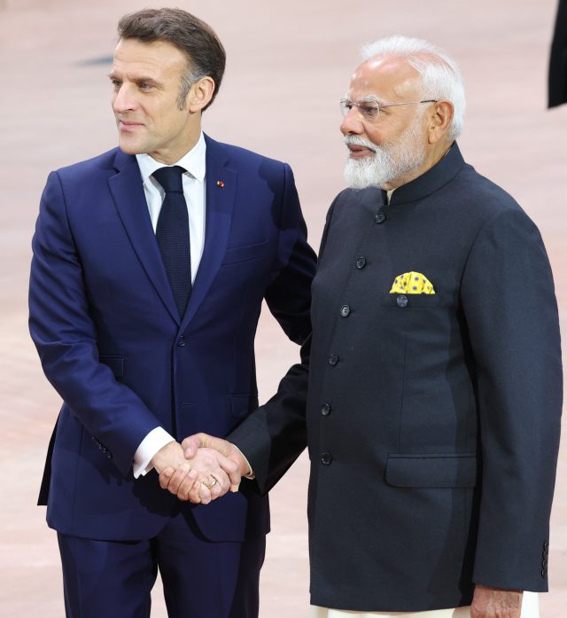 India AI Impact Summit 2026 Prime Minister Modi greets global tech CEOs on stage at Bharat Mandapam for the 2026 AI summit opening ceremony.